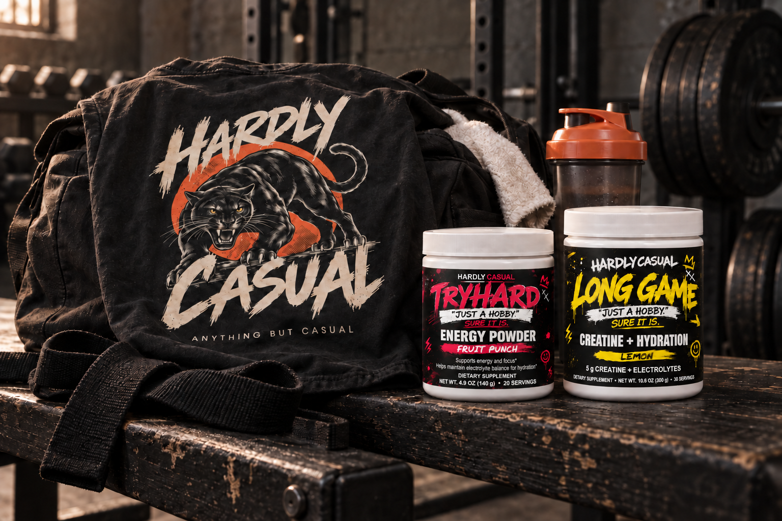 HardlyCasual gym kit with Panther tee, TRYHARD energy powder, and LONG GAME creatine